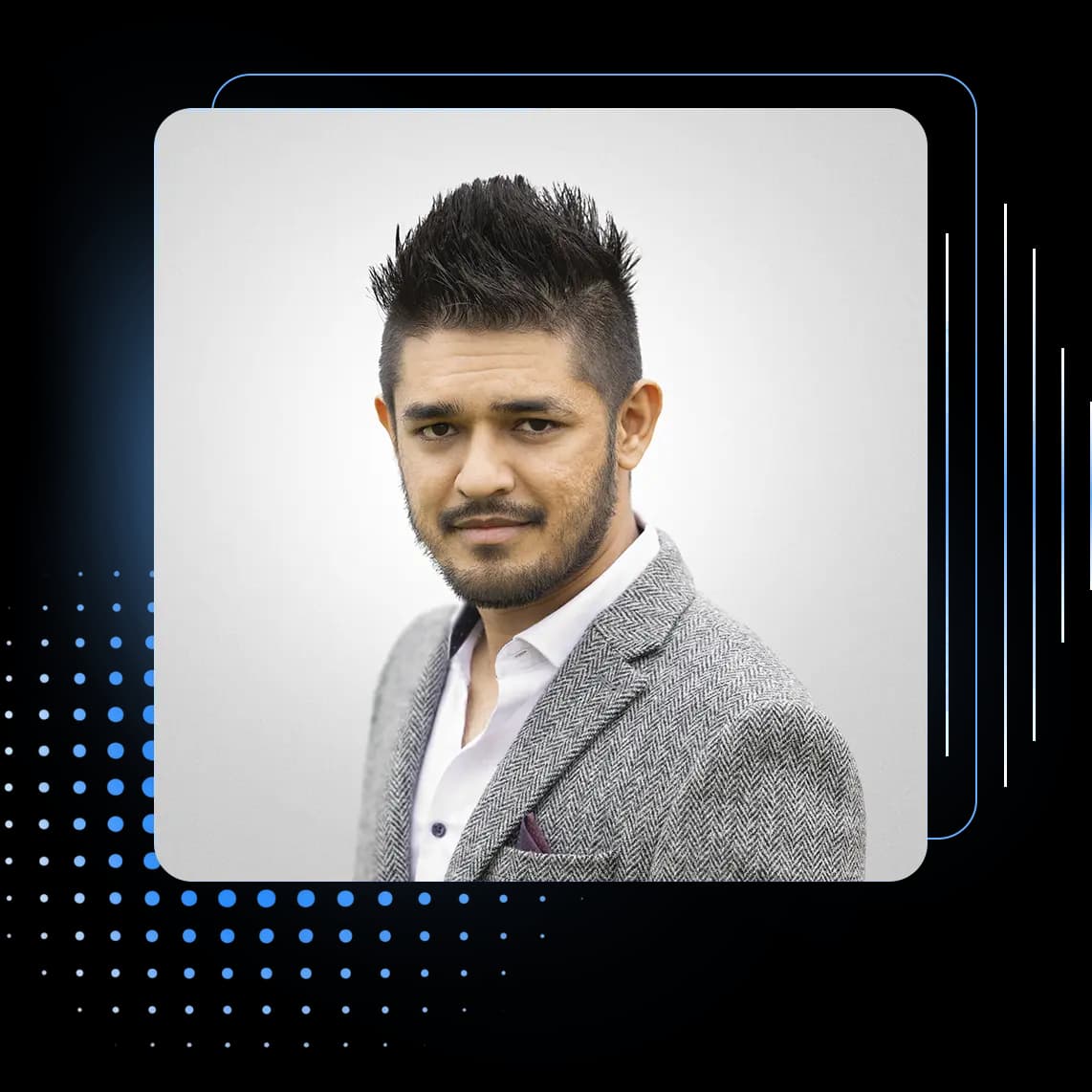 Aman Shakya wearing a gray blazer in a professional studio headshot