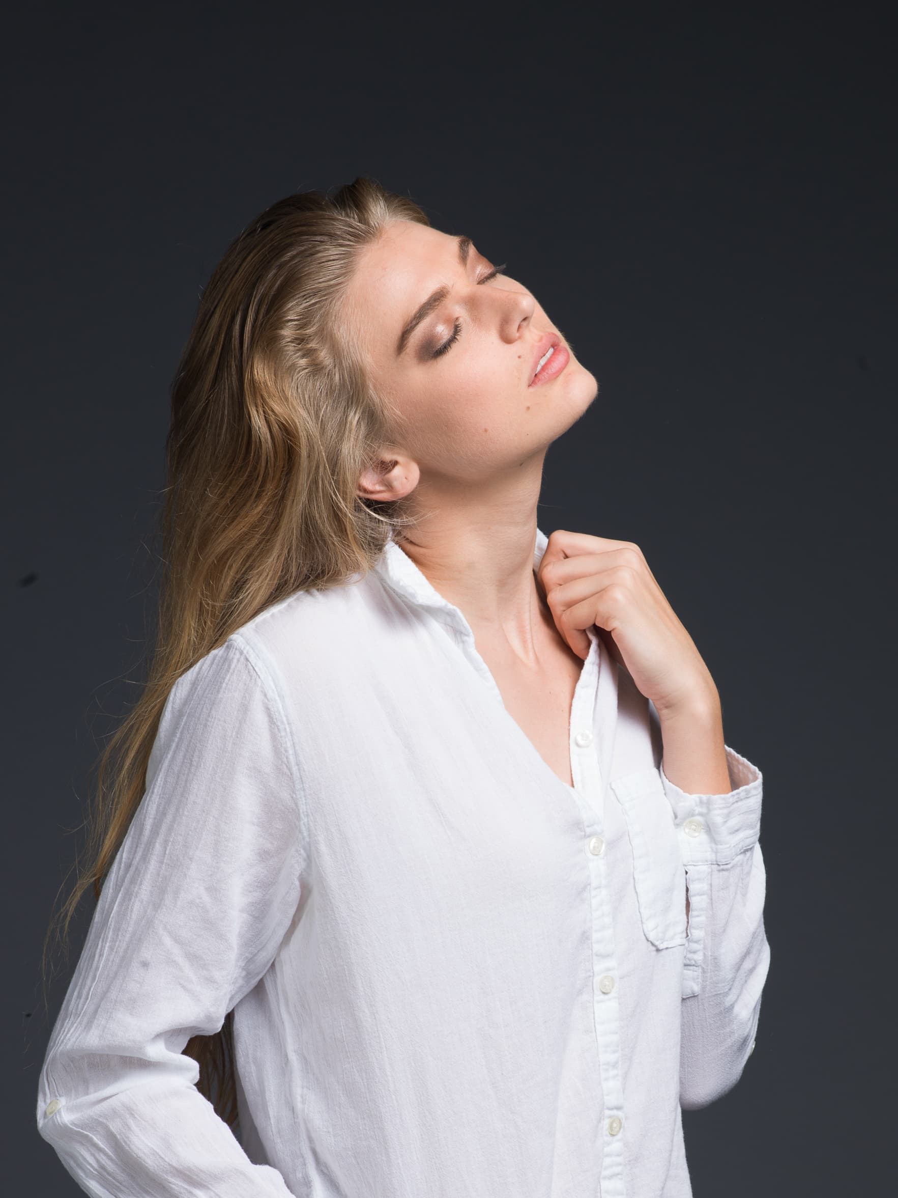 High-key conceptual portrait of a woman with an ethereal branching hair effect — before retouching