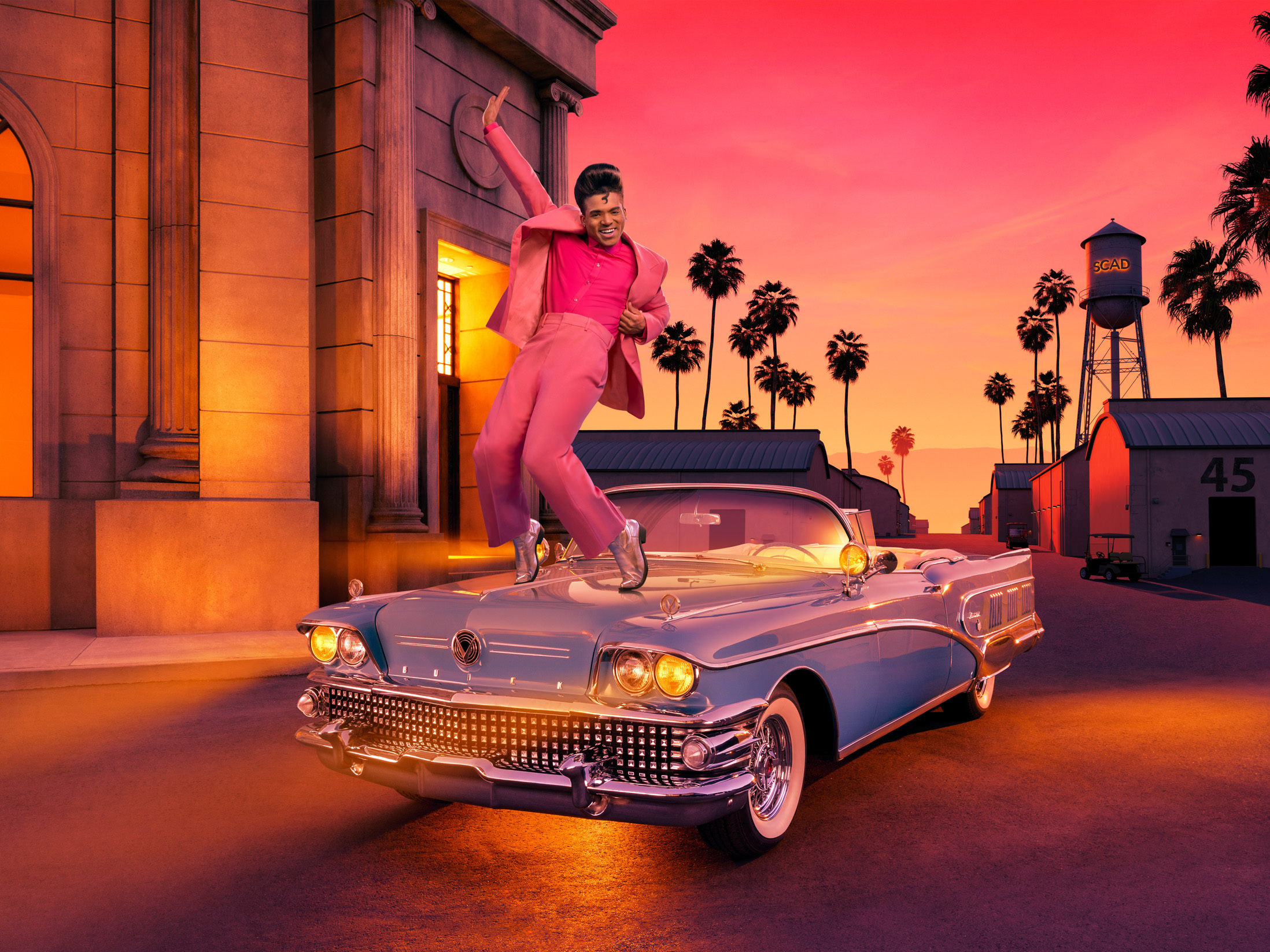 Brandon Bomer posing on a vintage convertible at SCAD Savannah Film Studios for the Film Festival campaign
